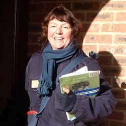 A royal mail post lady at the door