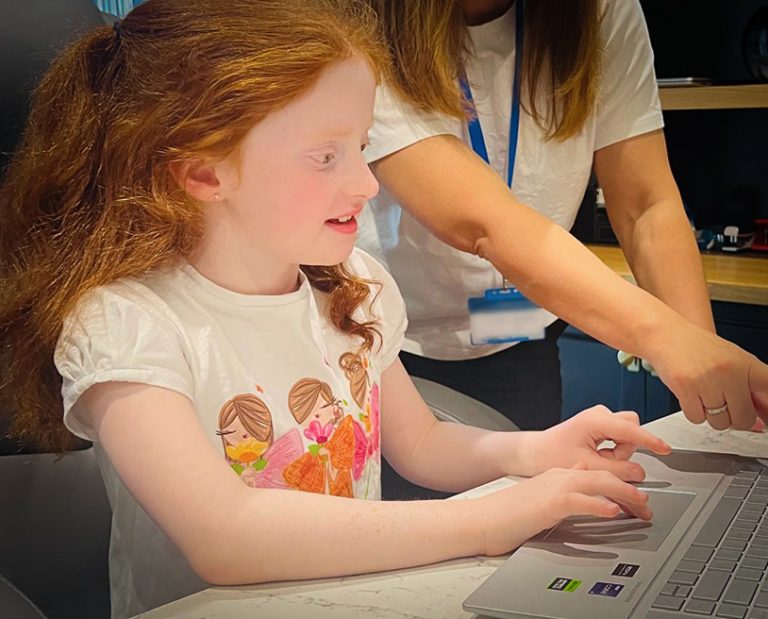 A small girl at the laptop