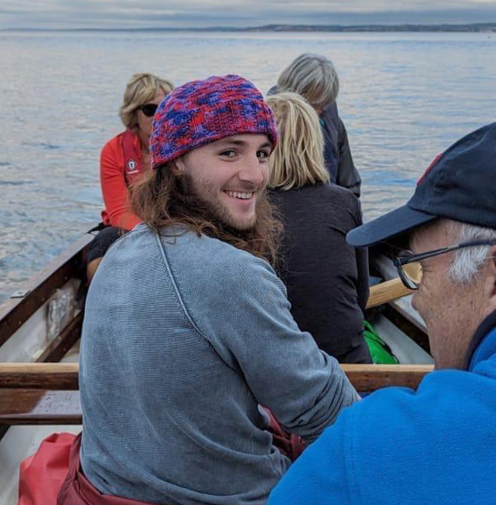 Young man in a rowing boat
